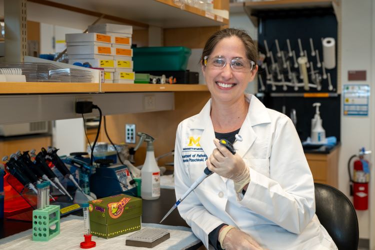 Dr. Catherine Ptaschinski working in her laboratory.